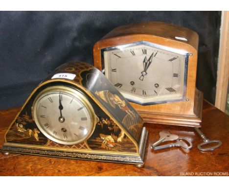 A japanned mantel clock and one other