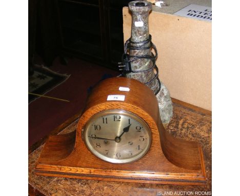 A large lighthouse table lamp, together with a mantel clock