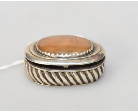 A George III white metal snuff box with hinged lid and fluted body, the lid inset with  a rounded oval tortoiseshell, unmarke