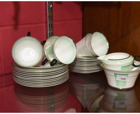 A 1930's style Shelley China tea service, comprising twelve plates and saucers, six plates a jug and sugar bowl, decorated in