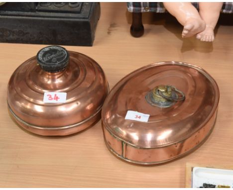 Two vintage copper hot water bottles