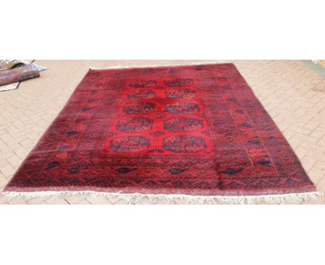 A vintage Afghan carpet. 2.9m x 2.29m