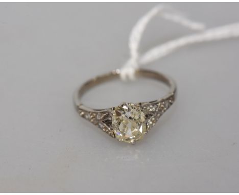 An early 20th Century diamond ring, circa 1920, on an unmarked band (probably platinum), the central stone approx. 1.43 carat