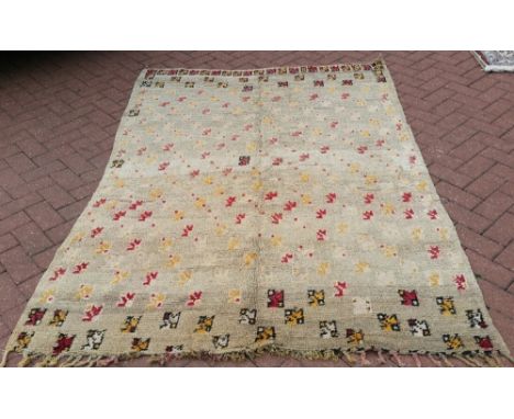 A vintage hand made Moroccan rug. 2.13m x 1.47m