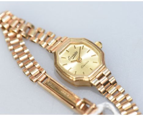 An Everite 9ct gold ladies watch with baton numerals within an octagonal shaped face on gold link strap, 