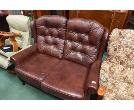 A two seater button backed sofa