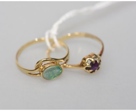 An Amethyst set ring claw set on 9ct gold mount and an opal ring, (2)