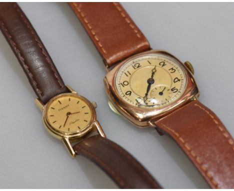 A Tissot 9ct gold ladies wristwatch with oval face and baton numerals and marked Saphir,  with leather strap, together with a