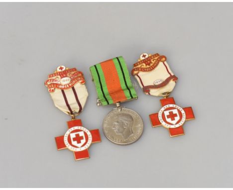 A WWII Defence medal & ribbon together with two red & white enamel Red Cross Society badges dated 1926 and 1949, inscribed ve