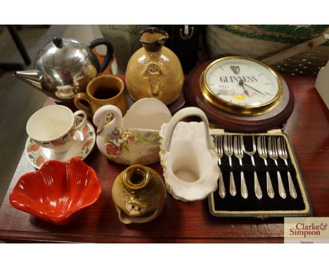 A Guinness wall clock together with a quantity of silver plated cutlery, a Susie Cooper cup and saucer, an Art Deco style tea