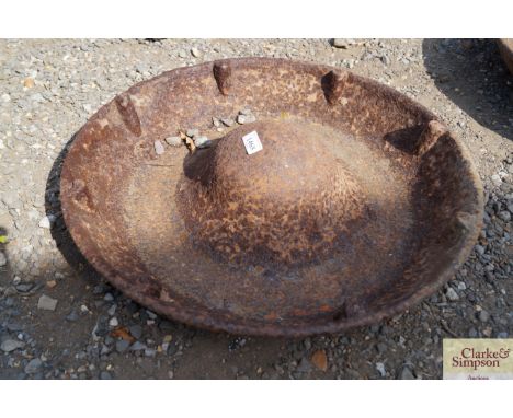 A cast iron pig trough