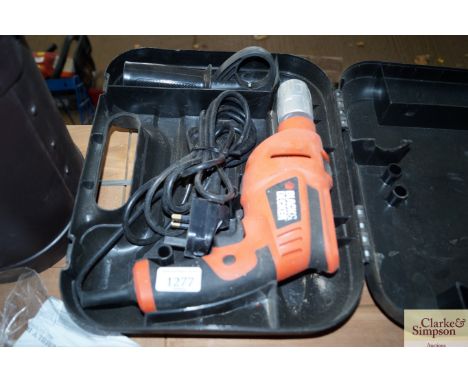 A Black &amp; Decker hammer drill in fitted case