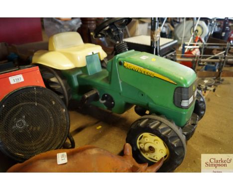 A pedal John Deere tractor 