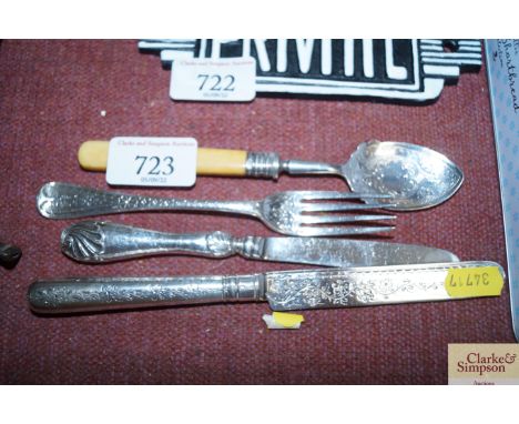 A silver fruit knife together with a silver handled knife, silver fork together with a silver Stilton spoon