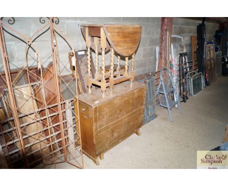 An oak drop lead table together with an oak gate leg table raised on barley twist supports 