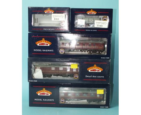 Bachmann OO Gauge, three boxed BR maroon coaches: 39-076D, 39-101A, 39-151B, one wagon 37-275C, boxed and one empty box.