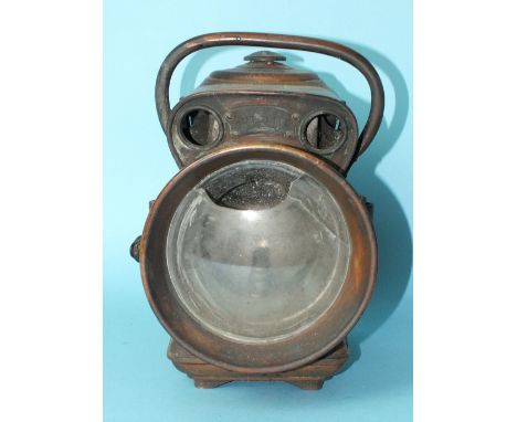 A Jos Lucas Ltd "Autolite" brass carbide car lamp numbered 594, 27cm high, (domed glass broken, handle rivets missing on one 