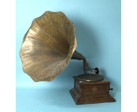 An early-20th century oak Zonophone horn table-top gramophone, the stepped case with Zonophone trademark transfer label and r