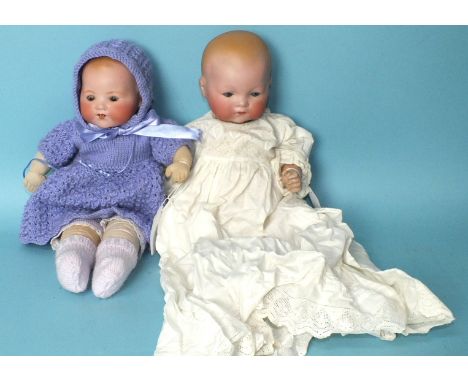 An Armand Marseille 341 baby doll, the bisque head with sleeping blue eyes, on jointed composition body, marked AM Germany 34
