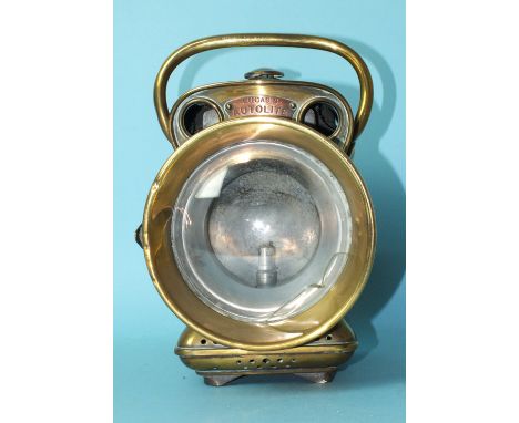 A Jos. Lucas Ltd "Autolite" brass carbide car lamp, numbered 594, 27cm high, (crack to domed glass).