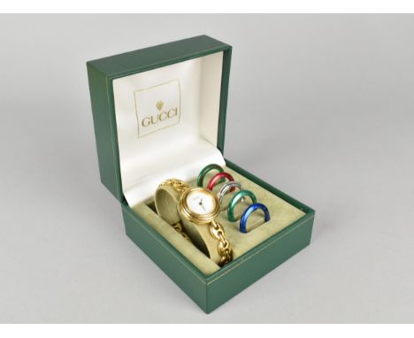 A Vintage Boxed Ladies Gucci Wristwatch, White Enamel Dial Inscribed Gucci, Swiss Made, Interchangeable Coloured Bezels, Gold