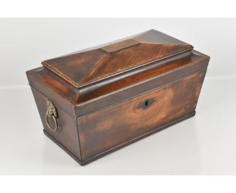A 19th Century Mahogany Sarcophagus Shaped Tea Caddy the Front with Bordered String, the Hinged Lid Opening to Reveal Two Tea