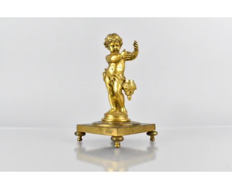 A Late 19th/Early 20th Century French Ormolu Mounted and Champleve Enamel Cherub Pen Holder, the Cherub Modelled Standing Upo