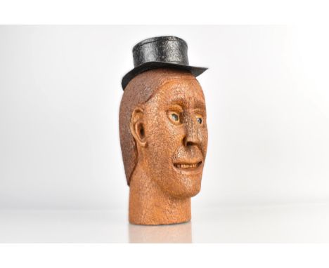 An Interesting Folk Art Carved Oak Male Head, Wearing a Painted Metal Wide Brimmed Hat, 27cm high