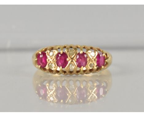 An Edwardian 18ct Gold Ruby and Diamond Ring, Four Claw Set Oval Cut Rubies, Largest 3.7mm by 2.3mm, and with Six Grain Mount