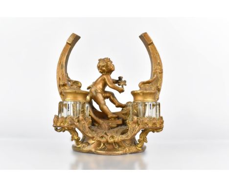 A Late 19th Century/Early 20th Century French Gilt Metal Inkstand Modelled as a Horseshoe with Seated Cherub with Two Glass I