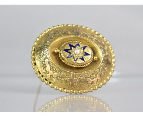 A Gold Coloured Metal Victorian Brooch, Central Pearl in Star Shaped Mount havig Blue Enamel Decoration, Set on Raised Oval P