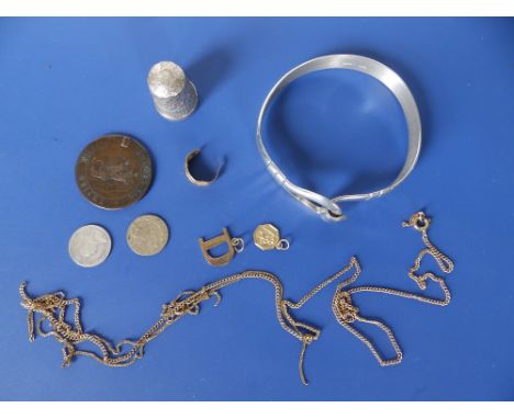 A very small quantity of gold jewellery, a Birmingham silver thimble, a bangle and three coins.