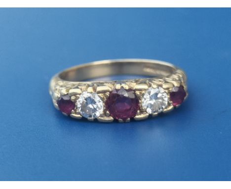 A graduated  five stone ruby &amp; diamond set 18ct gold ring.  Finger size N.