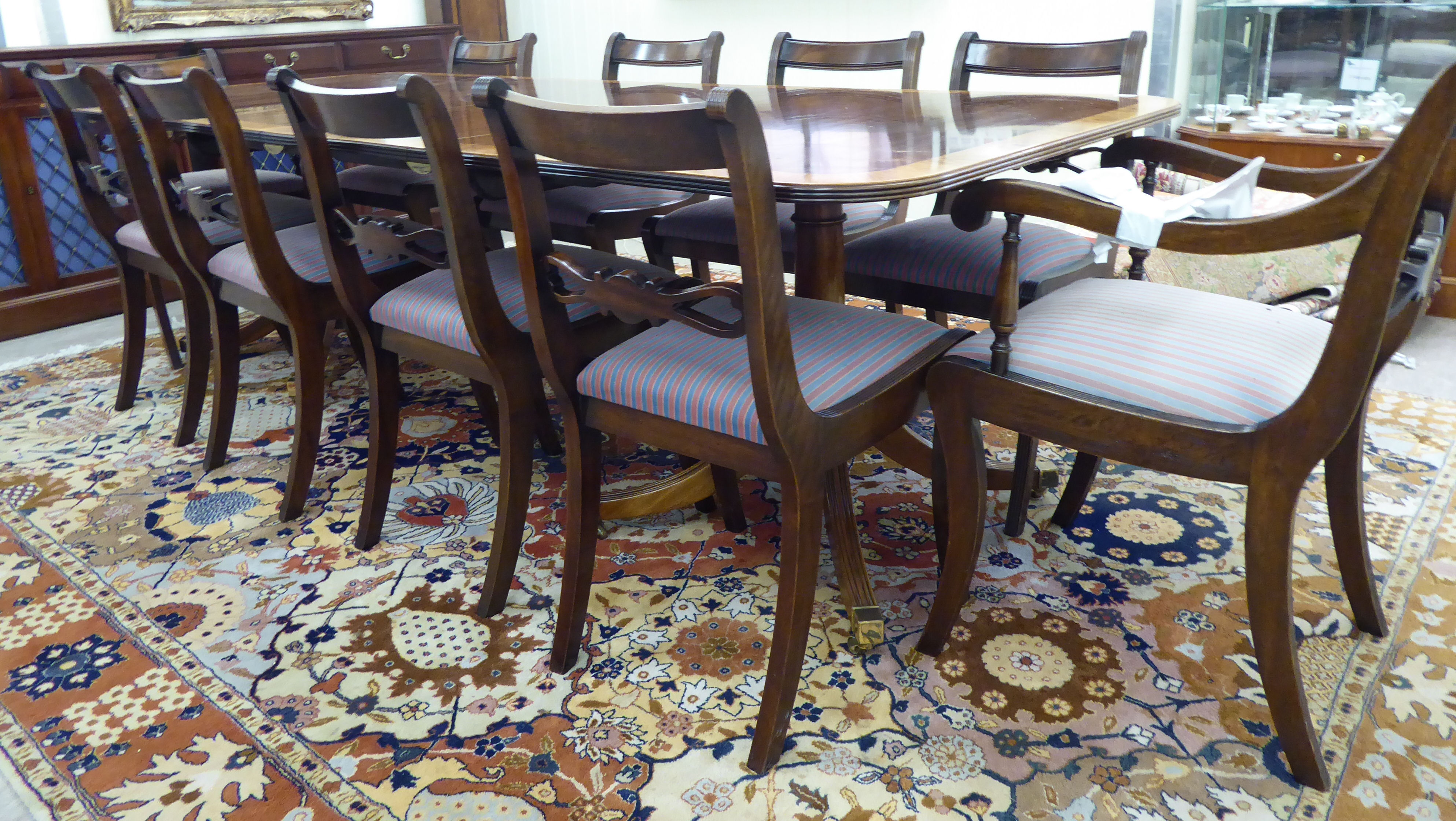 A Thomas Glenister of High Regency style mahogany finished twin