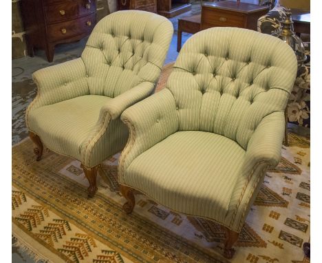 ARMCHAIRS, a pair, late Victorian walnut button upholstered on carved scroll supports, 77cm W. (2)