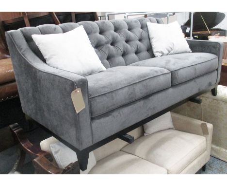 SOFA, buttoned back in charcoal upholstery with sloping arms, 182cm L x 90cm D x 80cm H.