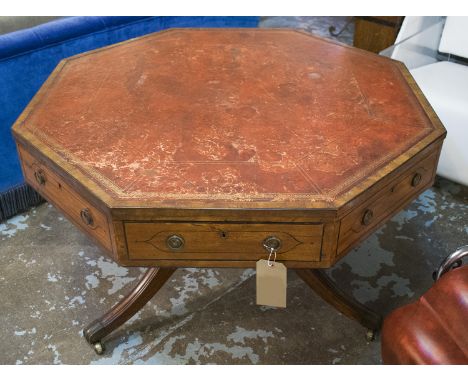 DRUM TABLE, Regency, mahogany and ebonised strung, with octagonal red leather top above four real and four dummy drawers, on 