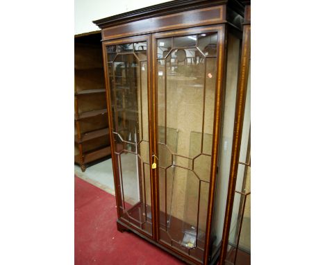 An Edwardian style mahogany and satinwood inlaid double door glazed china display cabinet raised on bracket supports, width 1