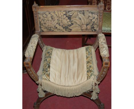 A late 19th century Spanish walnut and floral tapestry upholstered X-frame elbow chair