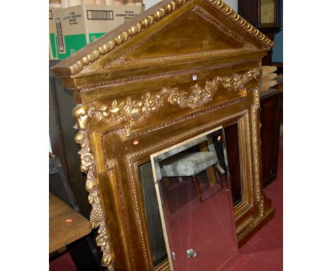 A large contemporary French empire style moulded and gilt decorated architectural over mantel mirror having bevelled glass pl
