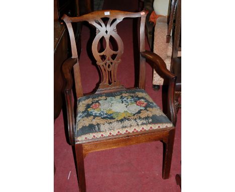 A 19th century mahogany Chippendale style single elbow chair having floral tapestry upholstered drop-in seat