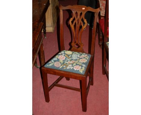 A set of four 19th century mahogany Chippendale style dining chairs, each having floral tapestry upholstered drop-in pad seat