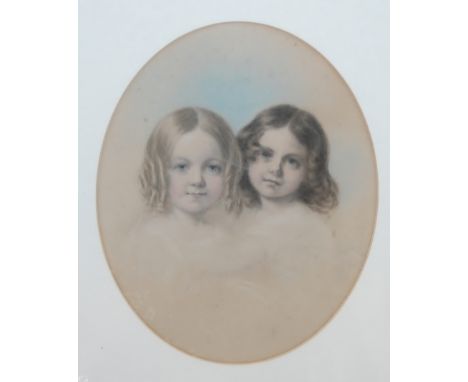 Late 19th century English school head & shoulders portrait of young siblings, pencil with watercolour, framed as an oval, 23.