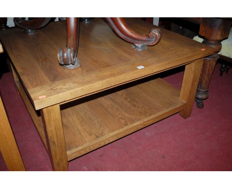 A contemporary joined light oak plank top square section two tier coffee table, width 100cm