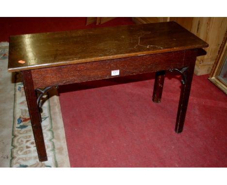 A 19th century oak low hall bench, w.79cm Condition Report / Extra Information Height 47.5cm, diameter 29.5cm. One spandrel m
