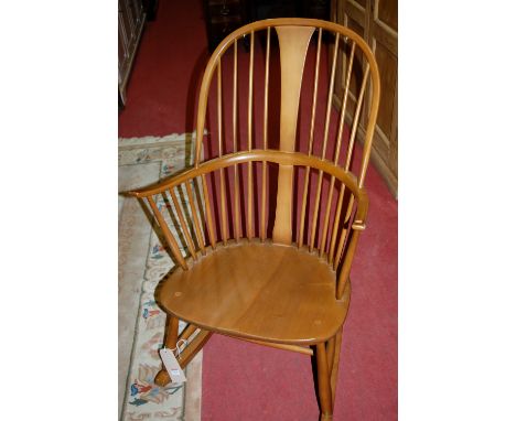 An Ercol mid elm stickback rocking Windsor chair