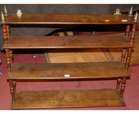 A circa 1900 oak open waterfall four tier hanging wall shelf