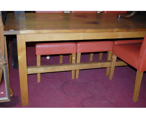 A light elm plank top refectory table having cleated ends and on square cut supports, length 196cm