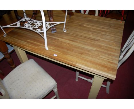 A contemporary light oak topped and cream painted rectangular kitchen table, length 130cm