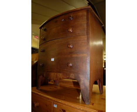 A 19th century mahogany bowfront hinge top chest commode